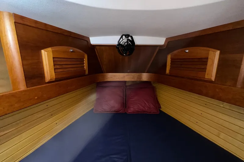 Slide: The Image of Cozy cabin interior of 2007 Sabre 386 sailboat with wooden finish and cushions. - 36