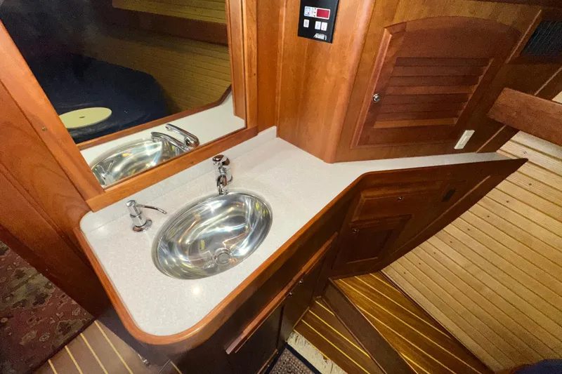 Slide: The Image of Luxurious wooden bathroom interior of 2007 Sabre 386 yacht with sleek sink and mirror. - 40