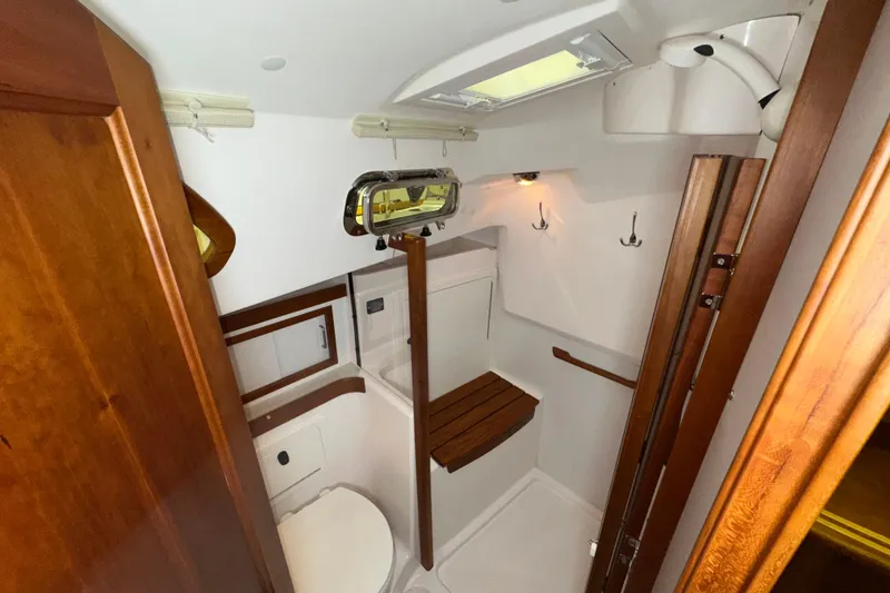 Slide: The Image of Compact bathroom in 2007 Sabre 386 yacht with wooden accents and modern fixtures. - 42