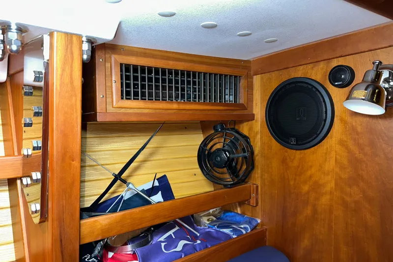 Slide: The Image of Interior of a 2007 Sabre 386 sailboat with wood paneling, fan, and speaker. - 45