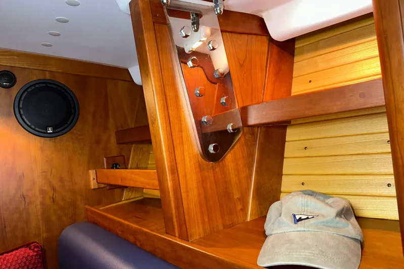 Slide: The Image of Interior of a 2007 Sabre 386 sailboat with wooden finish and speaker. - 47