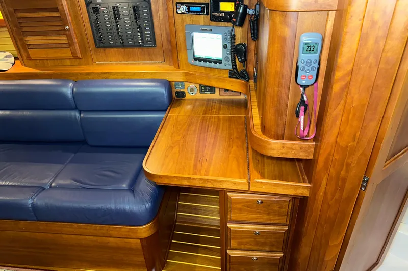 Slide: The Image of Interior of a 2007 Sabre 386 yacht with wooden cabinetry and navigation equipment. - 48