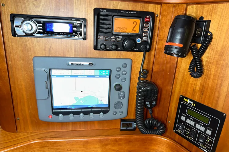 Slide: The Image of Navigation and communication equipment on a 2007 Sabre 386 yacht control panel. - 49