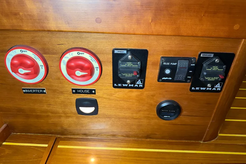Slide: The Image of Control panel of a 2007 Sabre 386 yacht with switches and bilge pump. - 51