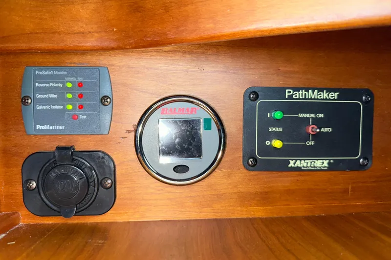 Slide: The Image of Electrical panel with ProMariner, Balmar, and Xantrex controls on a 2007 Sabre 386. - 52