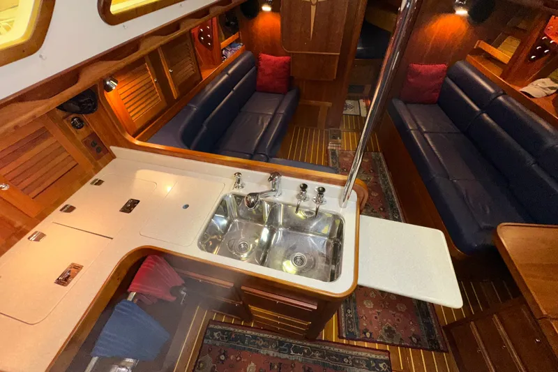 Slide: The Image of Luxurious 2007 Sabre 386 yacht interior with elegant wood finish and modern amenities. - 57