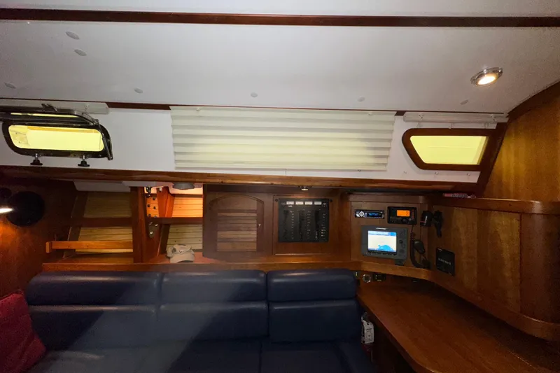 Slide: The Image of Interior of a 2007 Sabre 386 sailboat with navigation equipment and seating area. - 63