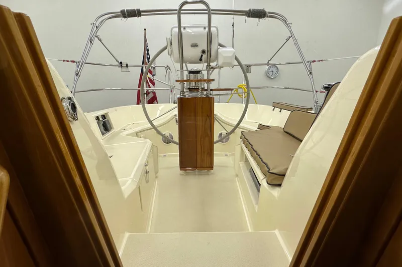 Slide: The Image of Interior view of 2007 Sabre 386 sailboat cockpit with steering wheel and seating. - 72