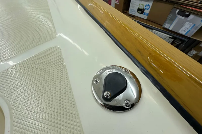 Slide: The Image of Close-up of a 2007 Sabre 386 boat deck with a chrome fitting and textured surface. - 75