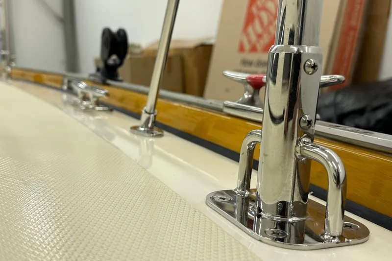 Slide: The Image of Close-up of a 2007 Sabre 386 sailboat's polished metal fittings and textured deck surface. - 85