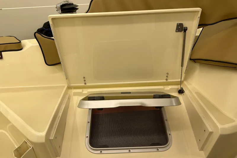 Slide: The Image of Open hatch on 2007 Sabre 386 boat, showcasing storage compartment and seating area. - 89