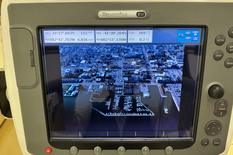 Slide: The Image of Boat navigation system displaying aerial view of marina, Sabre 386, 2007 model. - 98
