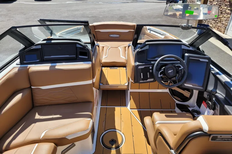 Slide: The Image of Luxurious interior of 2026 Supra SV 400 boat with tan leather seating and modern dashboard. - 10