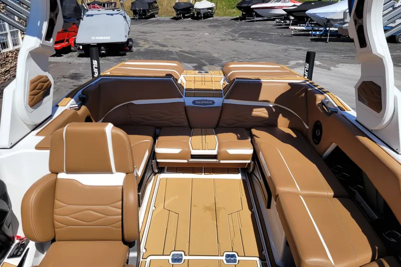Slide: The Image of 2026 Supra SV 400 boat interior with luxurious brown seating and modern design. - 14