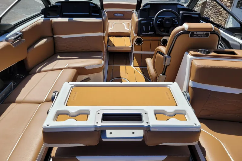 Slide: The Image of 2026 Supra SV 400 boat interior with tan leather seating and modern dashboard. - 17