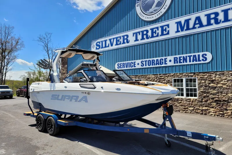 Slide: The Image of 2026 Supra SV 400 boat on trailer at Silver Tree Marine. - 4