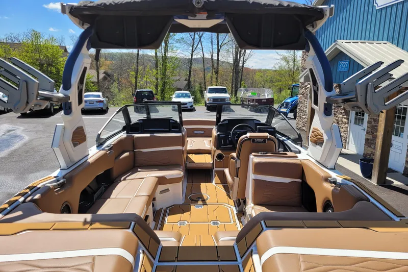 Slide: The Image of Luxurious 2026 Supra SV 400 boat interior with tan leather seating and advanced dashboard. - 8