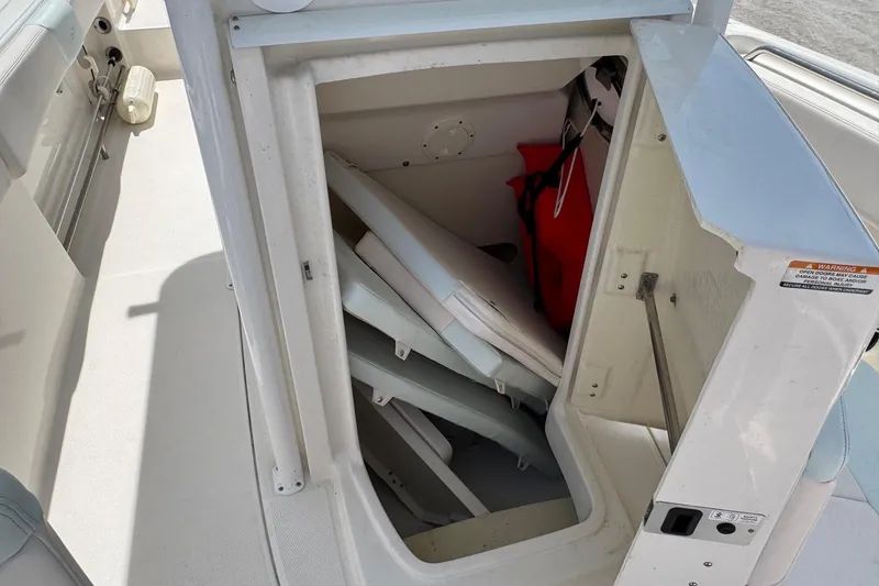 Slide: The Image of Storage compartment in 2018 Robalo R242 Center Console boat. - 13