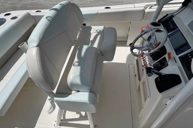Slide: The Image of Interior of 2018 Robalo R242 Center Console with helm station. - 15