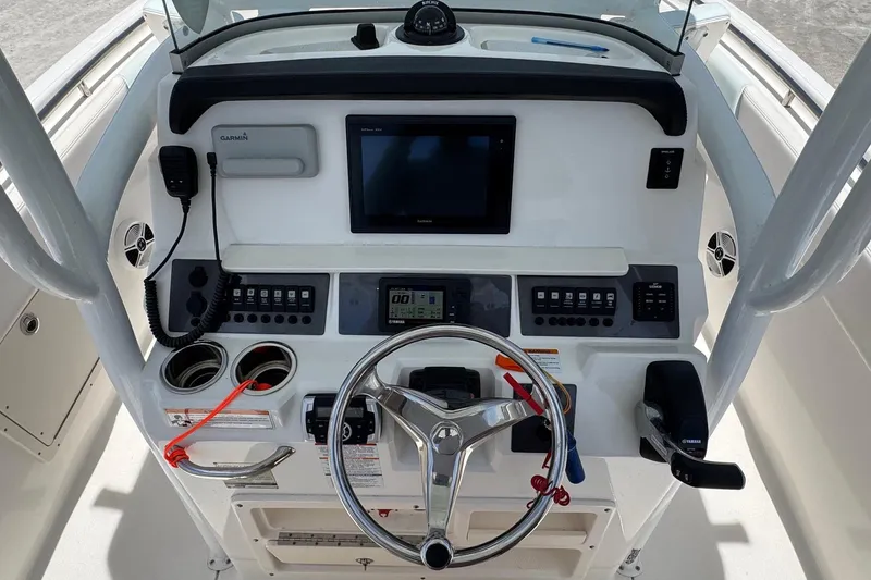 Slide: The Image of Control console of 2018 Robalo R242 Center Console boat. - 16