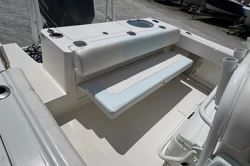 Slide: The Image of 2018 Robalo R242 Center Console with seating and storage. - 18
