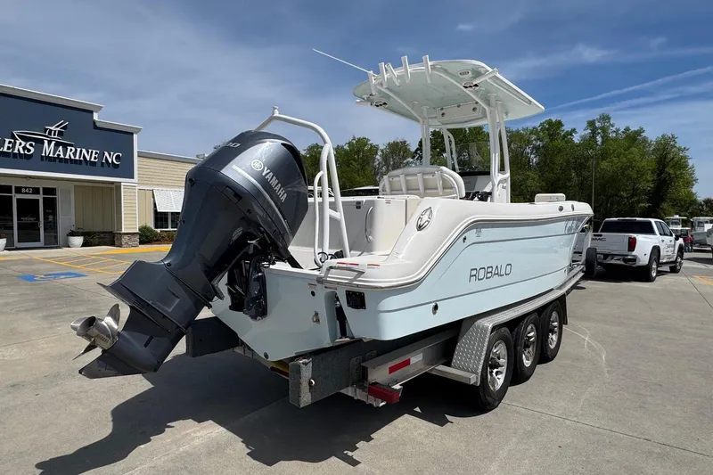 Slide: The Image of 2018 Robalo R242 Center Console boat on trailer at dealership. - 3