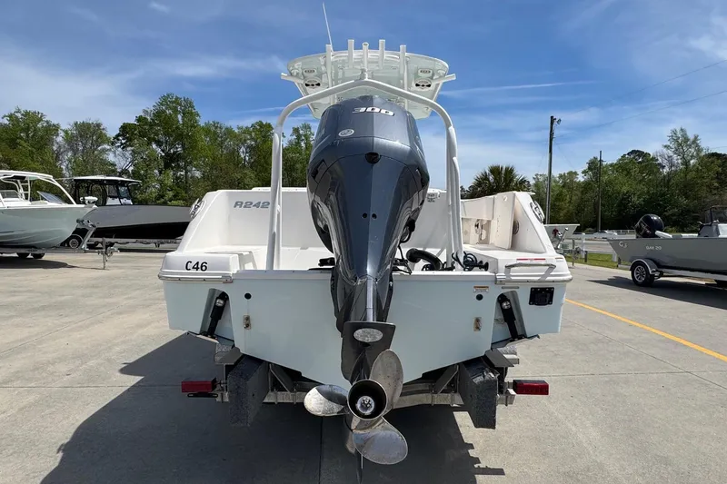 Slide: The Image of 2018 Robalo R242 Center Console with outboard motor on trailer. - 4