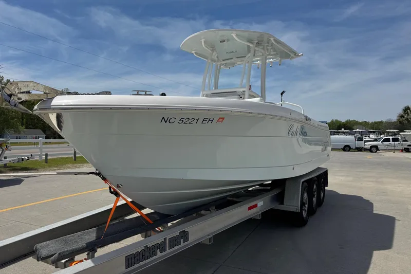 Slide: The Image of 2018 Robalo R242 Center Console boat on trailer. - 6