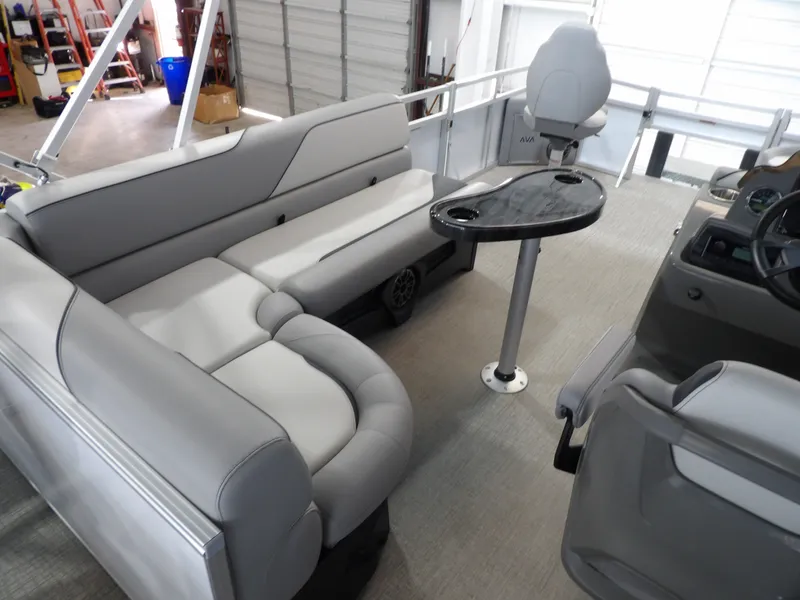 Slide: The Image of Interior of 2026 Avalon Venture Quad Fish with gray seating and table. - 25