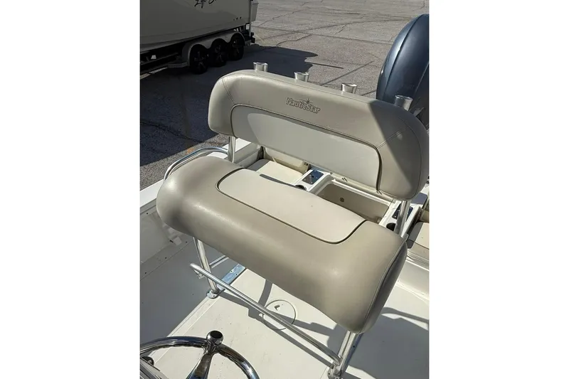 Slide: The Image of 2015 NauticStar 224 XTS boat seat with rod holders, beige upholstery. - 5