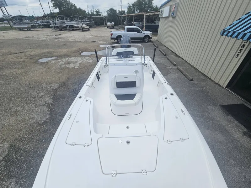 Slide: The Image of Tidewater 2110BMT 2026 boat parked outside a building. - 17