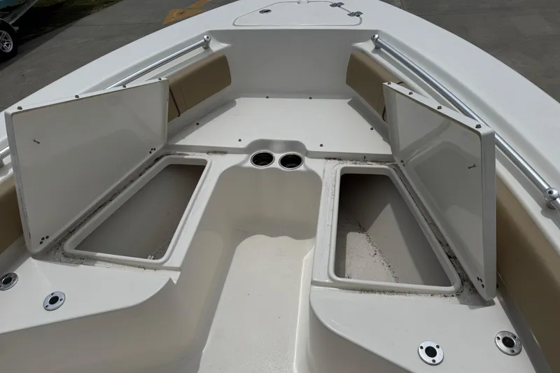 Slide: The Image of 2019 Key West 219 FS boat with open storage compartments. - 12