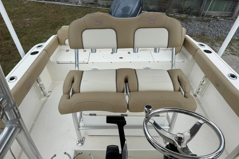 Slide: The Image of Interior of a 2019 Key West 219 FS boat with steering wheel and bench seat. - 15