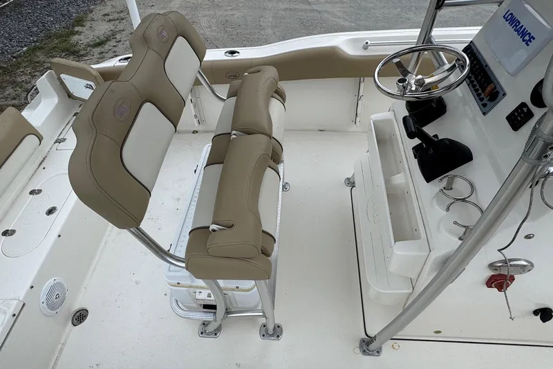 Slide: The Image of Interior view of a 2019 Key West 219 FS boat with helm console. - 16