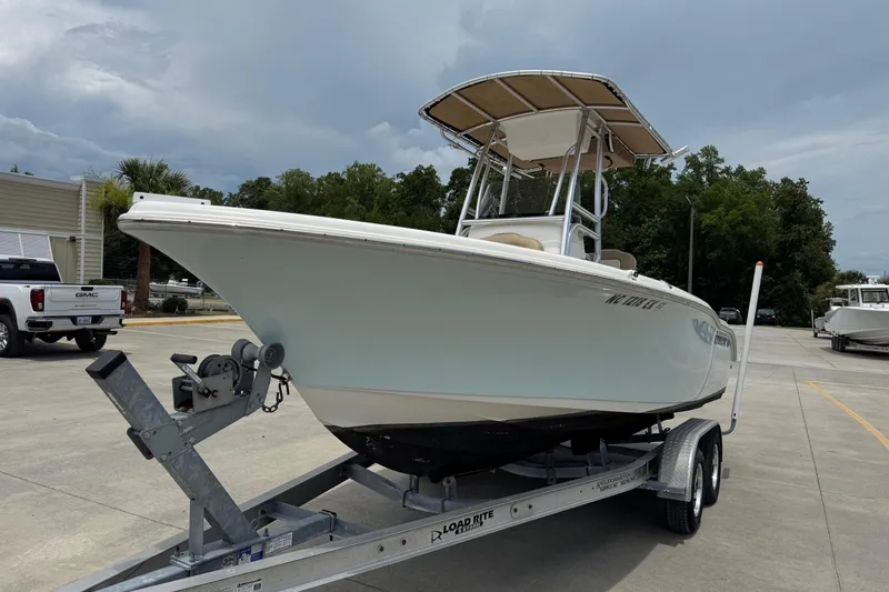 Slide: The Image of 2019 Key West 219 FS boat on trailer outdoors. - 3