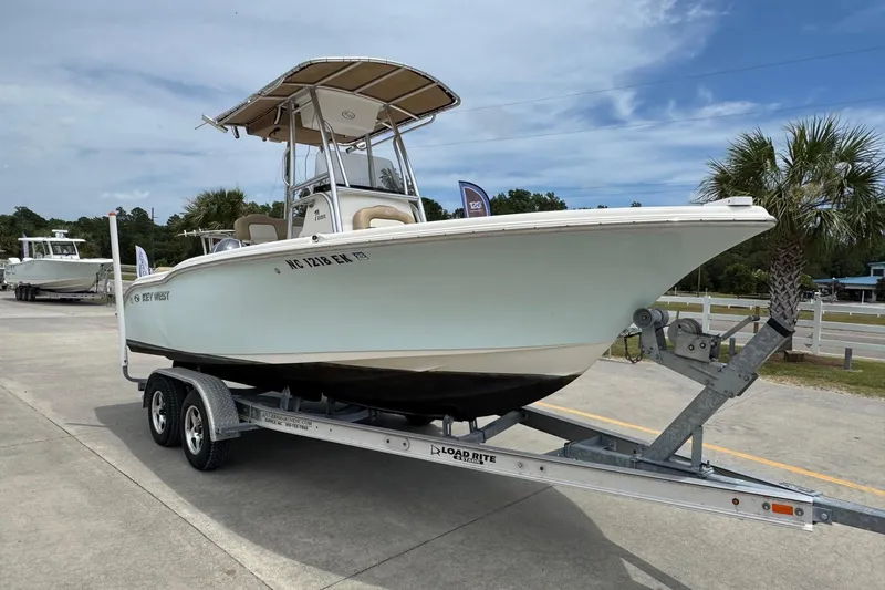 Slide: The Image of 2019 Key West 219 FS boat on trailer outdoors. - 6