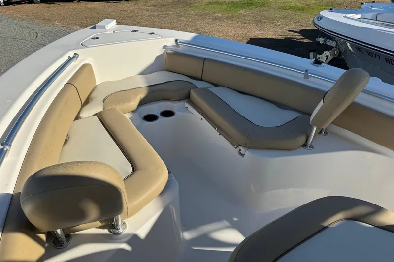 Slide: The Image of Interior view of a 2019 Key West 219 FS boat with beige seating. - 7