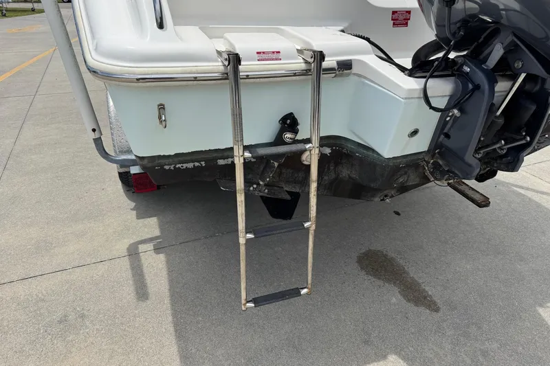 Slide: The Image of Rear view of a 2019 Key West 219 FS with ladder. - 9