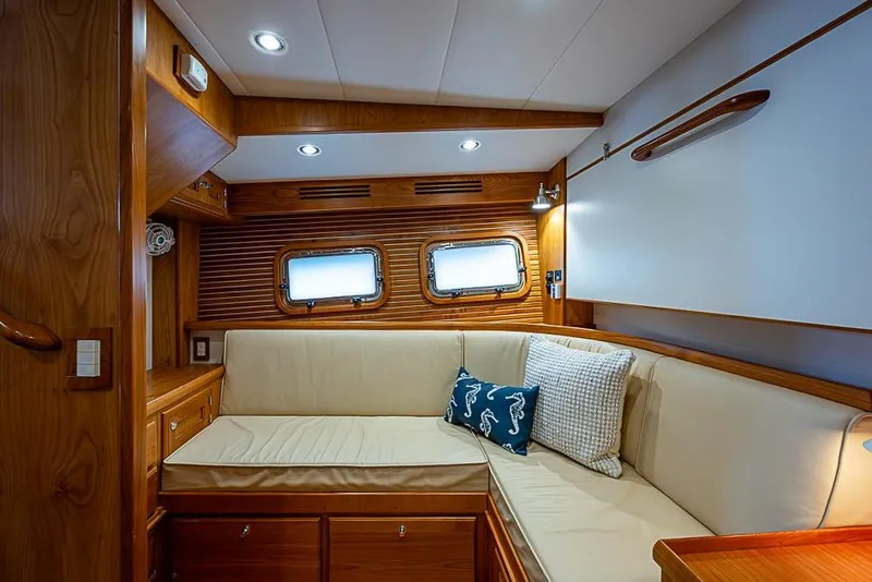 Slide: The Image of Luxurious 2016 Kadey-Krogen 52 yacht interior with cozy seating and elegant wood finish. - 40