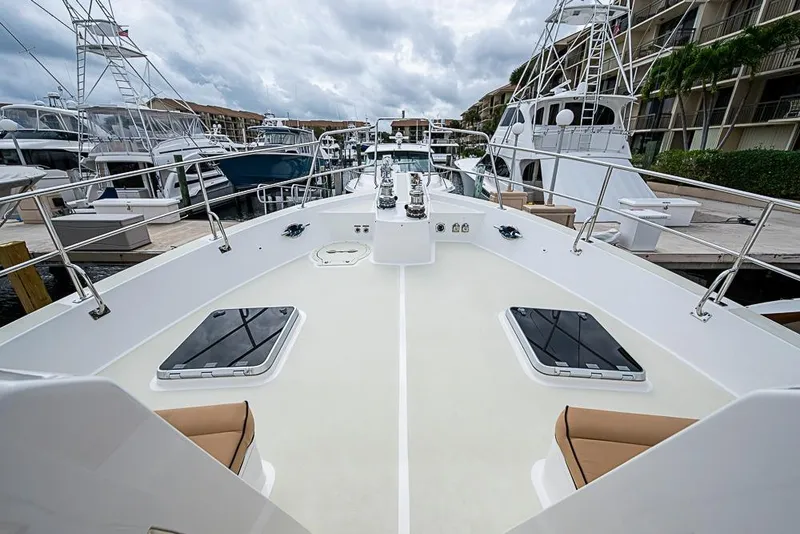 Slide: The Image of Bow view of 2016 Kadey-Krogen 52 yacht docked at marina under cloudy skies. - 55