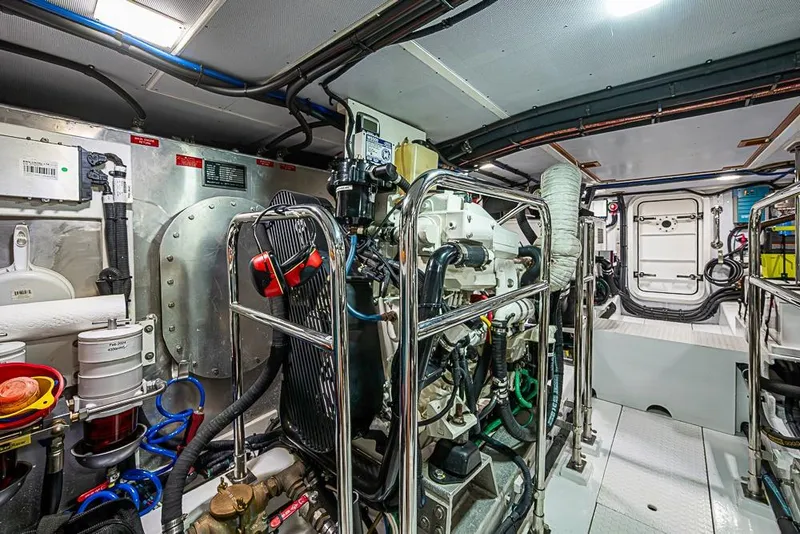 Slide: The Image of Engine room of 2016 Kadey-Krogen 52 yacht, showcasing mechanical components and systems. - 74