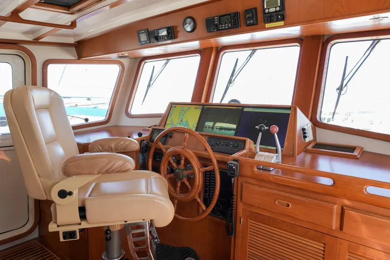 Slide: The Image of Pilothouse of 2008 Kadey-Krogen 48 North Sea yacht with navigation equipment and captain's chair. - 13
