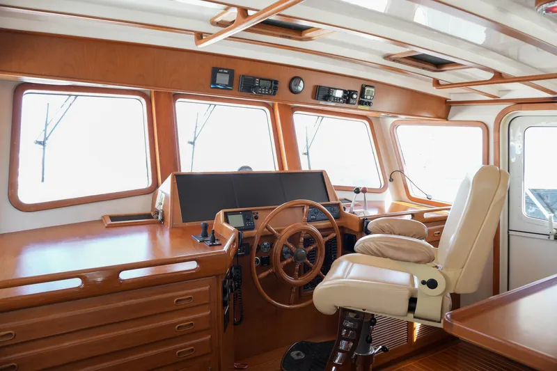 Slide: The Image of Luxurious helm of 2008 Kadey-Krogen 48 North Sea yacht with wooden accents and modern controls. - 17