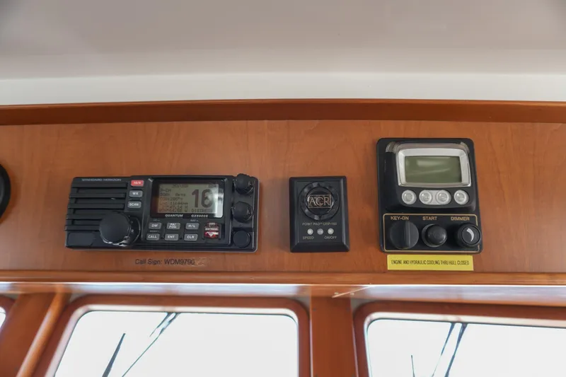 Slide: The Image of Control panel of a 2008 Kadey-Krogen 48 North Sea yacht with radio and navigation equipment. - 24