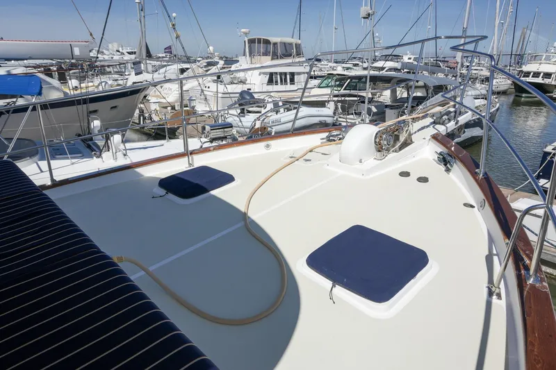 Slide: The Image of 2008 Kadey-Krogen 48 North Sea yacht deck at marina, surrounded by boats. - 47