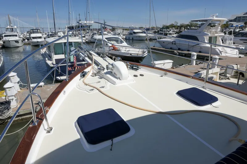 Slide: The Image of 2008 Kadey-Krogen 48 North Sea yacht docked at marina, surrounded by other boats. - 48