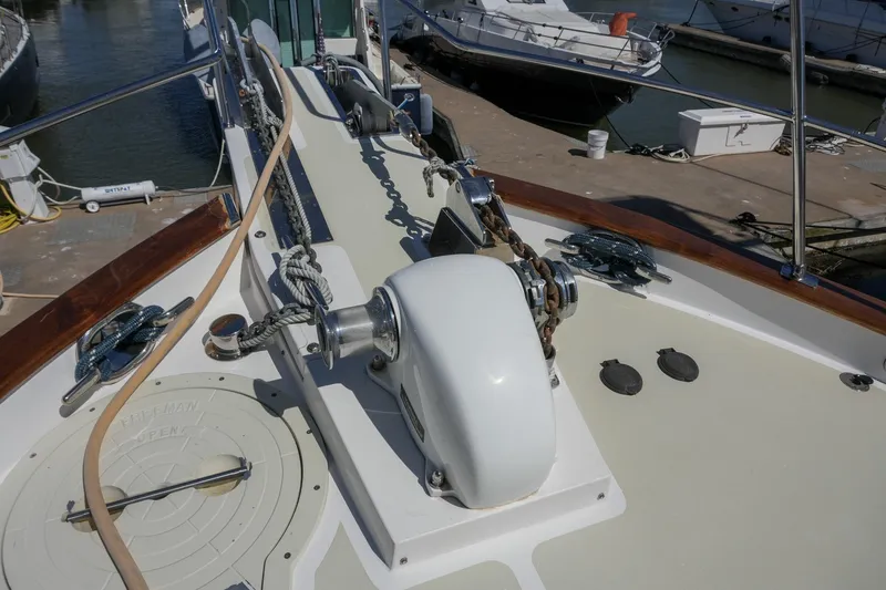 Slide: The Image of Bow deck of 2008 Kadey-Krogen 48 North Sea yacht with anchor chain and winch. - 49