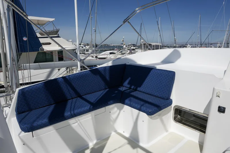 Slide: The Image of 2008 Kadey-Krogen 48 North Sea yacht with blue cushioned seating on deck. - 61