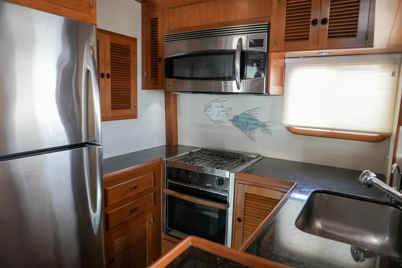 Slide: The Image of Modern kitchen in 2008 Kadey-Krogen 48 North Sea yacht with stainless steel appliances. - 8