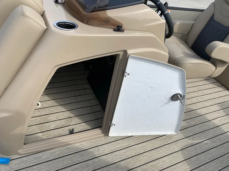 Slide: The Image of Open storage compartment on a 2021 Starcraft SLS 3 boat. - 13